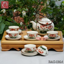Bộ ấm chén men kem tròn quai đồng hoa Sen đỏ